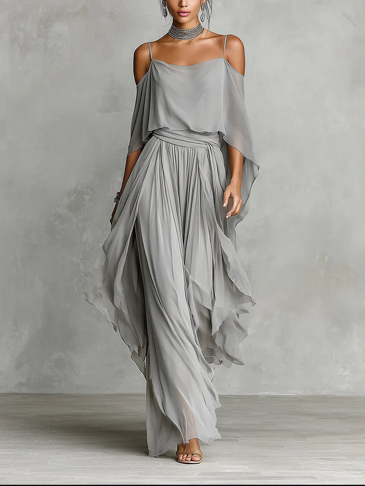 Set in gray chiffon with a fluid tank top and off-the-shoulder pants