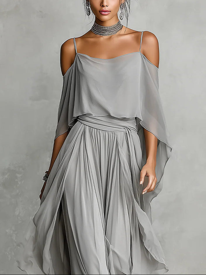 Set in gray chiffon with a fluid tank top and off-the-shoulder pants