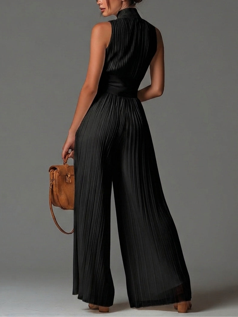 Black sleeveless jumpsuit with V-neck, zipper, pleated, and wide leg in chiffon