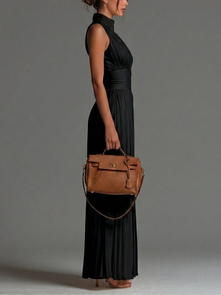 Black sleeveless jumpsuit with V-neck, zipper, pleated, and wide leg in chiffon